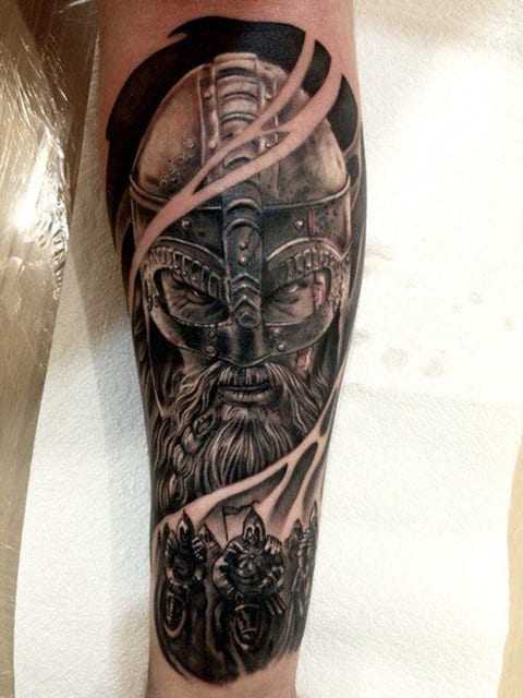 Tattoo of a bogatyr on the forearm for men