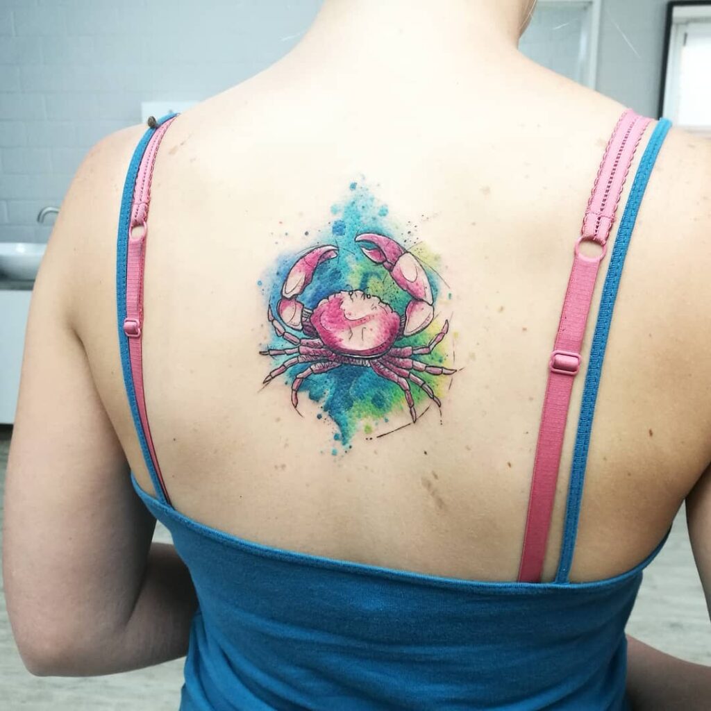 Tattoo of the zodiac sign cancer on the back for women