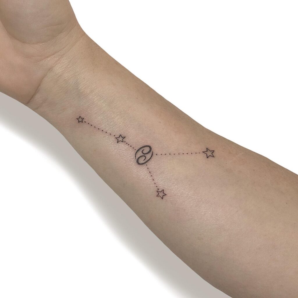 Tattoo of the zodiac sign Cancer on the forearm for women