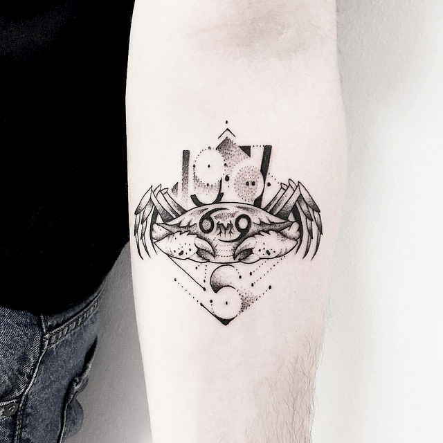 Tattoo of the zodiac sign of Cancer on the forearm for men