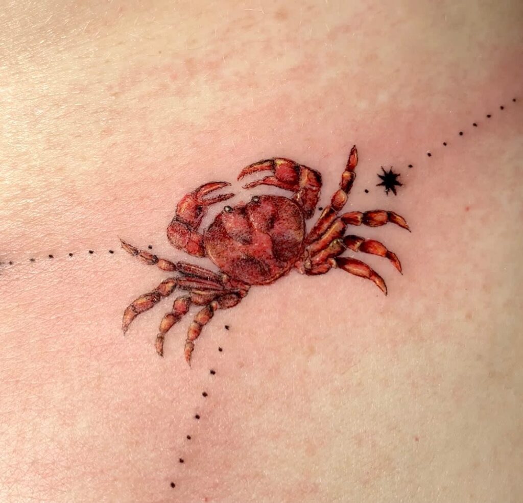 Tattoo of the zodiac sign Cancer for women