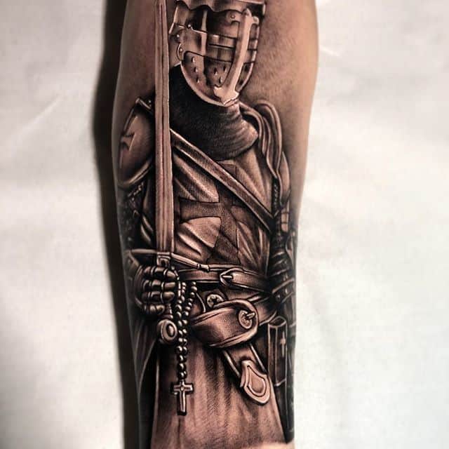 Tattoo of a gladiator on the arm for men