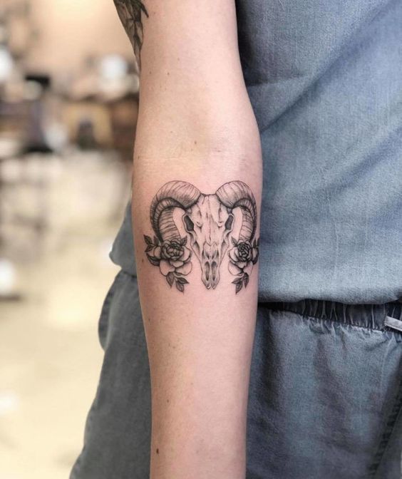 Tattoo of the zodiac sign Aries on the forearm for women