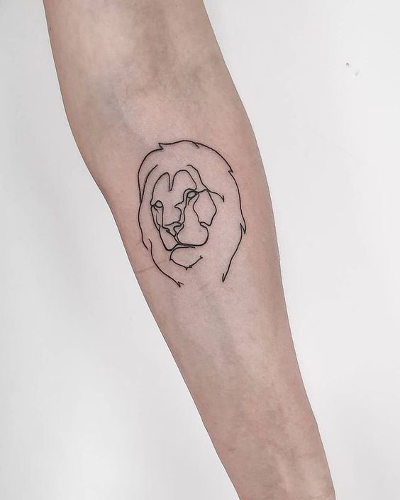 Tattoo of the zodiac sign lion on the forearm for women