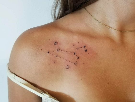 Tattoo of the constellation zodiac sign lion on the collarbone for women