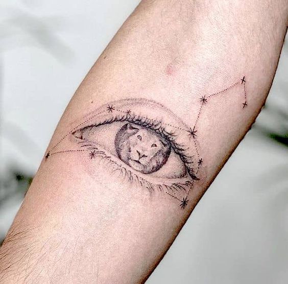 Tattoo of the constellation zodiac sign lion on the forearm for men