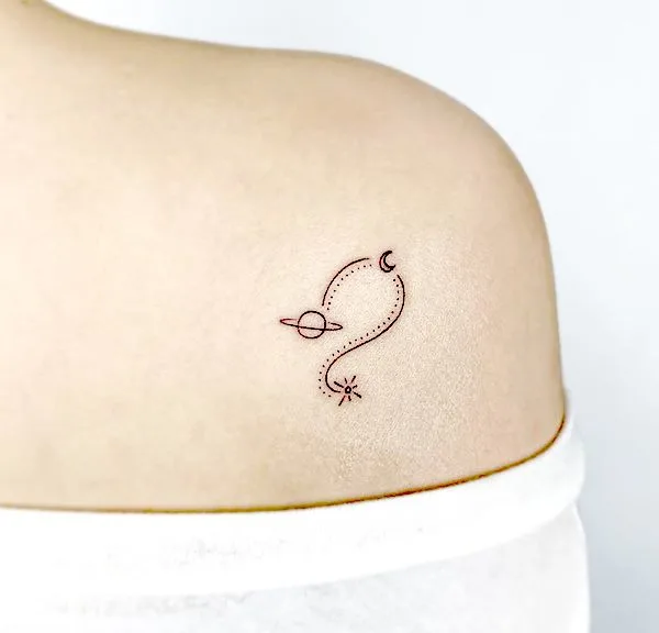 Tattoo of the constellation zodiac sign lion on the shoulder for women