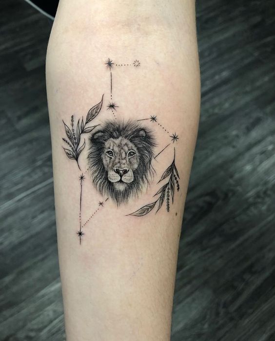 Tattoo of the constellation zodiac sign lion on the forearm