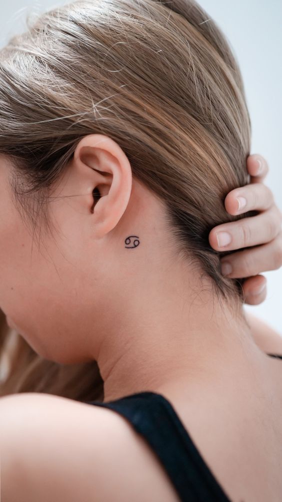 Zodiac sign cancer tattoo on the neck for women