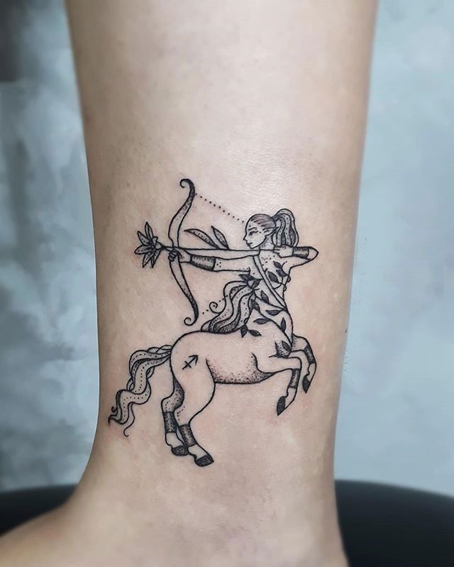 Sagittarius zodiac sign tattoo on the shin for women