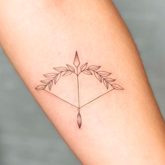 Tattoo of the zodiac sign Sagittarius on the forearm for women