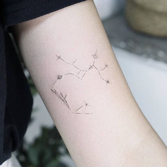 Tattoo constellation zodiac sign Sagittarius on the shoulder