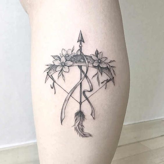 Sagittarius zodiac sign tattoo on the calf for women