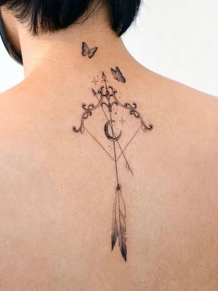 Sagittarius zodiac sign tattoo on the back for women