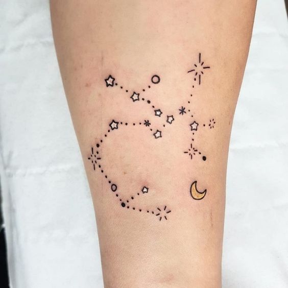 Tattoo of the constellation sign of the zodiac Sagittarius on the calf for women