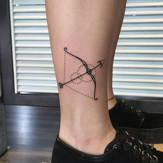 Sagittarius zodiac sign tattoo on the shin for women