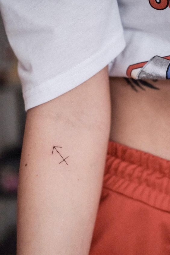 Tattoo symbol zodiac sign Sagittarius on the forearm for women