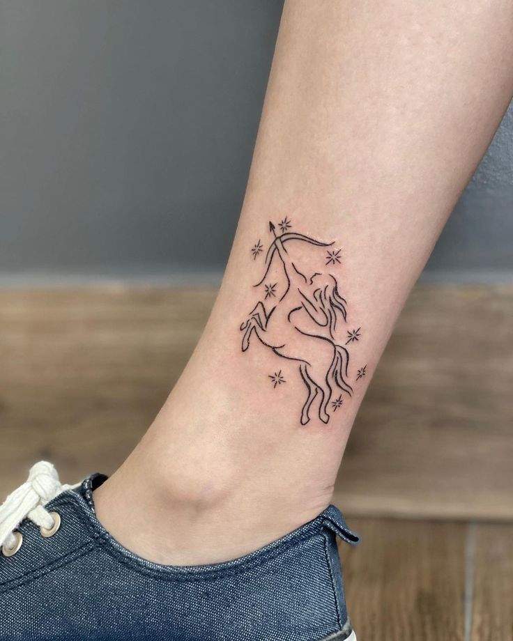 Sagittarius zodiac sign tattoo on the shin for women