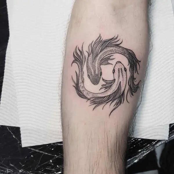 Tattoo of the zodiac sign of a fish on the forearm for men