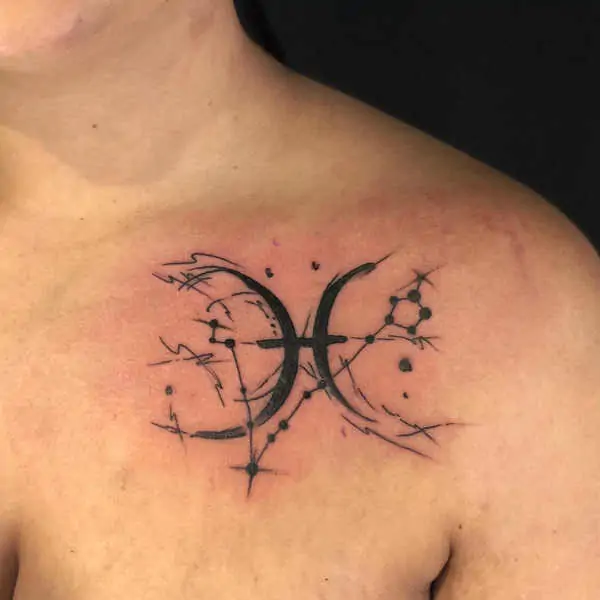 Tattoo of the zodiac sign fish symbol on the collarbone for men