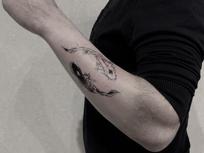 Tattoo of the zodiac sign of a fish on the forearm for men