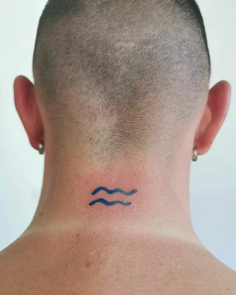 Aquarius zodiac sign tattoo on the back of the head for men