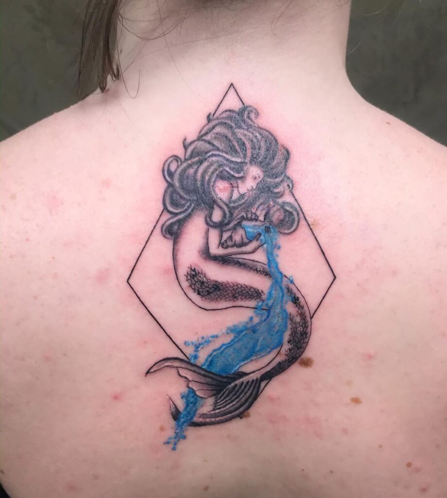 Aquarius zodiac sign tattoo on the back for women