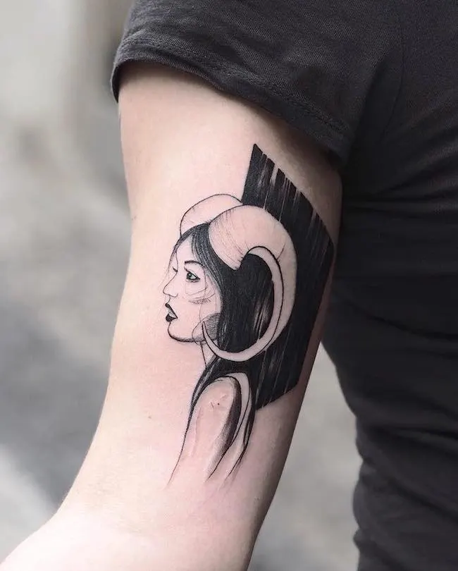 Tattoo of the zodiac sign Aries on the shoulder for women