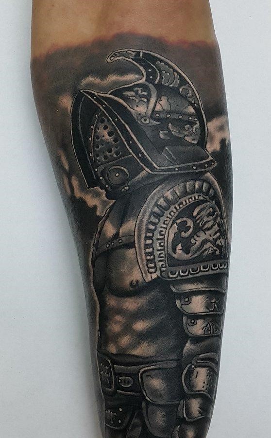 Tattoo of a gladiator on the forearm for men