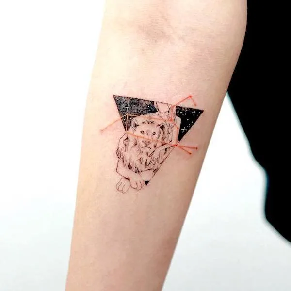 Tattoo of the constellation zodiac sign lion on the forearm