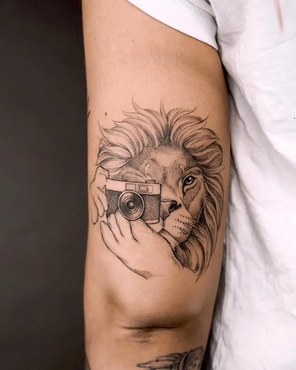 Tattoo of the zodiac sign lion on the shoulder for women