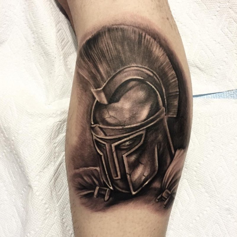 Spartan tattoo on the calf for men