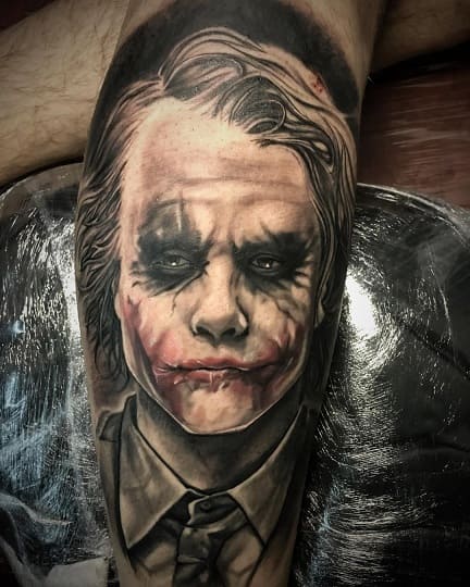 Joker tattoo on the shin