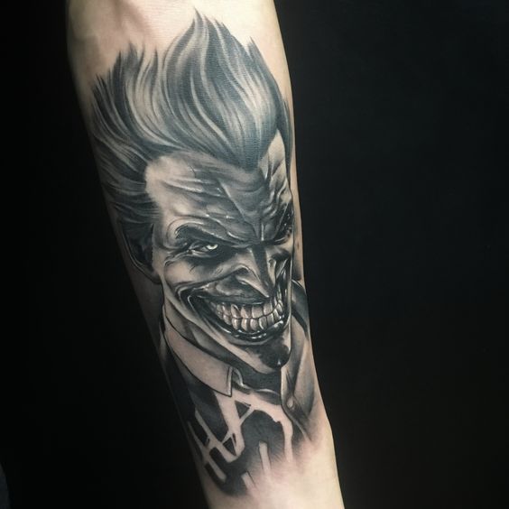 Joker tattoo on the forearm for men