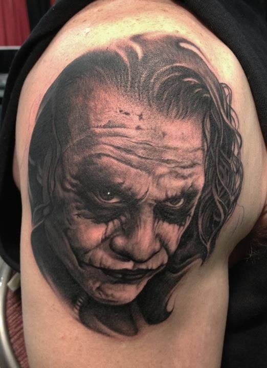 Joker tattoo on the shoulder for men