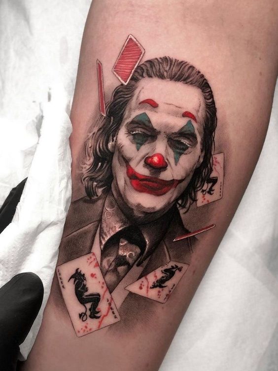 Joker tattoo on the forearm for women