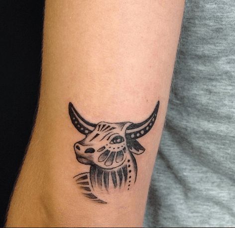 Tattoo of a bull on the shoulder for men