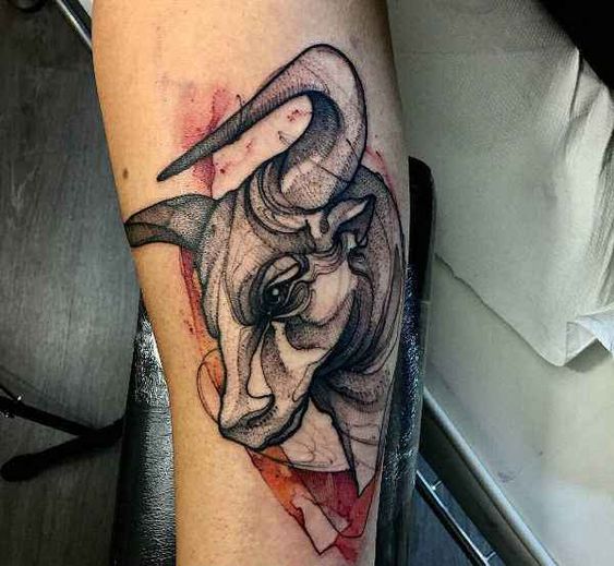 Tattoo of a bull on the arm