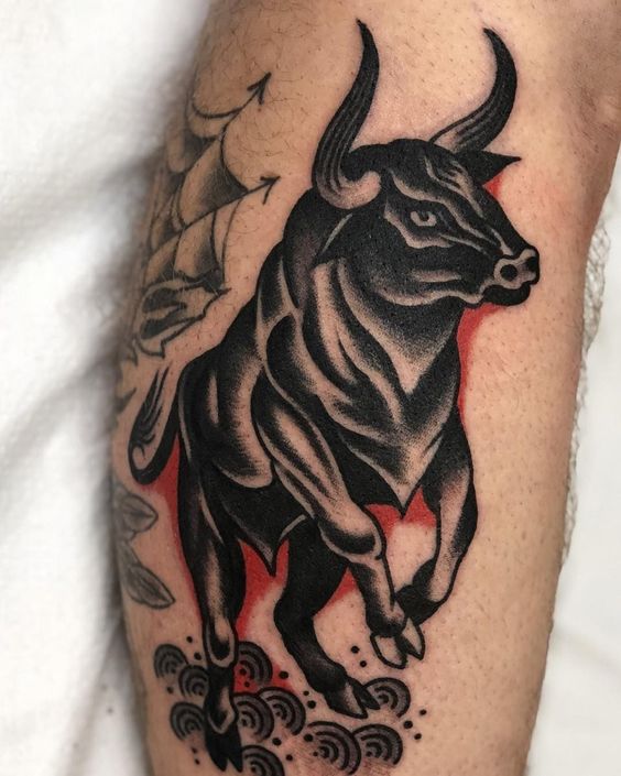 Tattoo of a bull on the arm