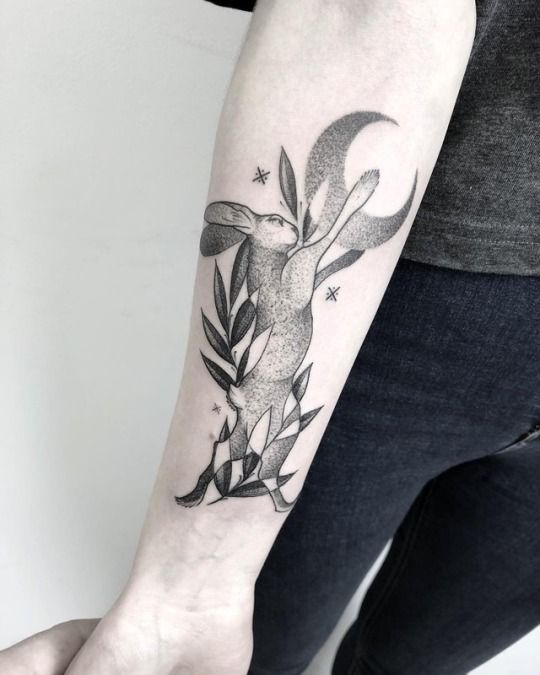 Tattoo of a hare (rabbit) on the forearm for women