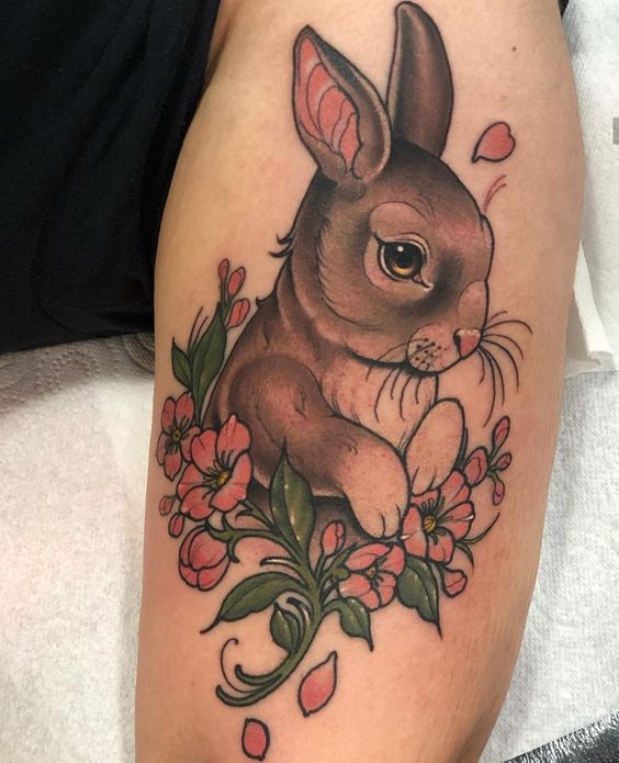 Tattoo of a hare (rabbit) on the shoulder for men