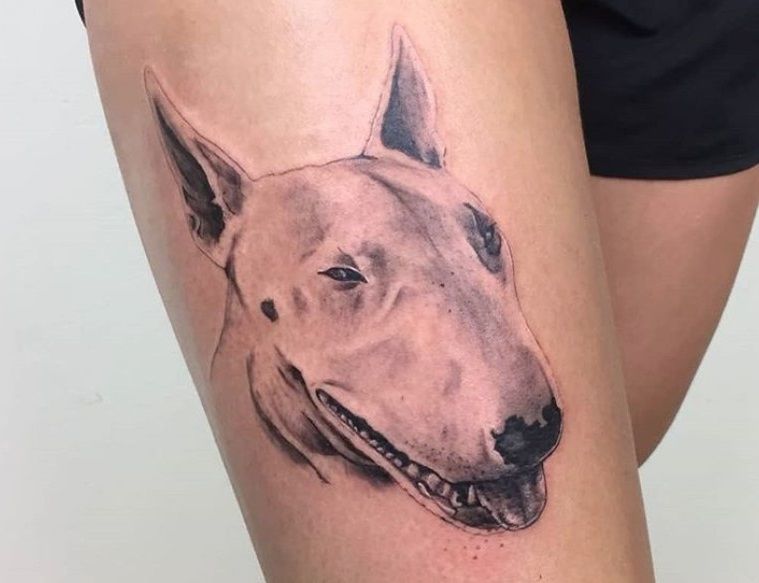 Bull Terrier tattoos on the thigh for women