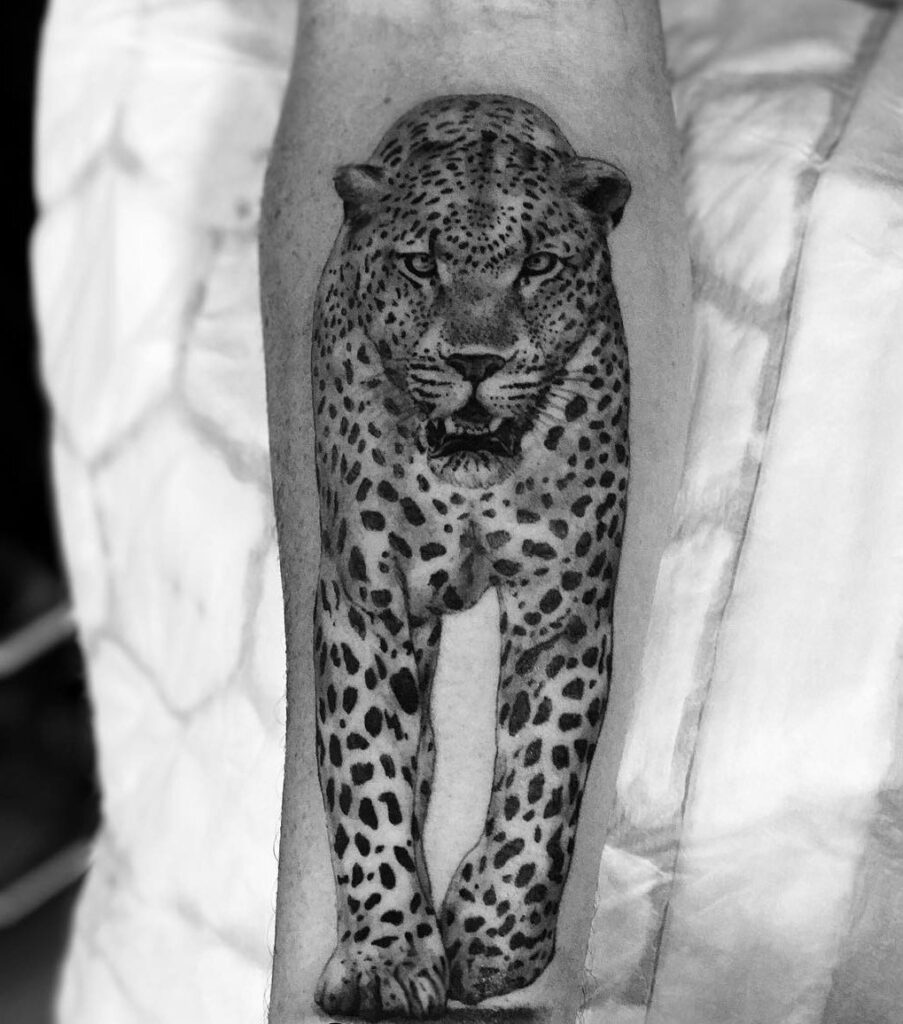 Cheetah tattoo on the forearm for men