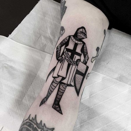 Tattoo of a knight on the shoulder for men