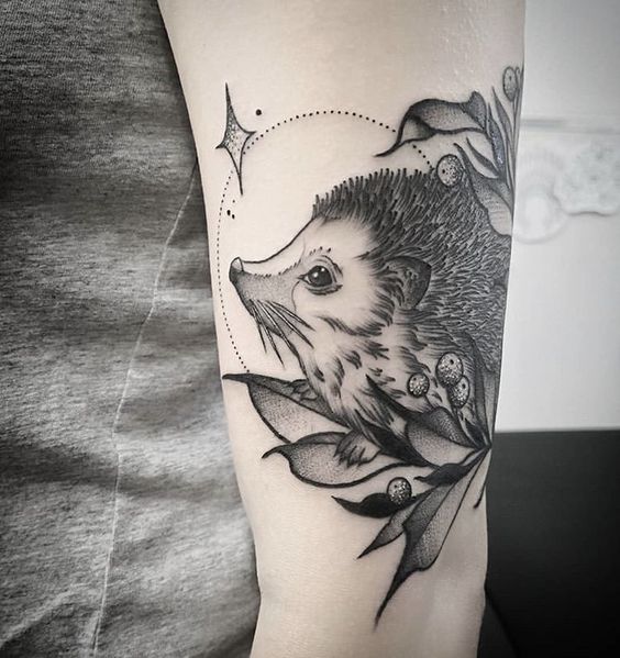 Tattoo of a hedgehog on the shoulder for women