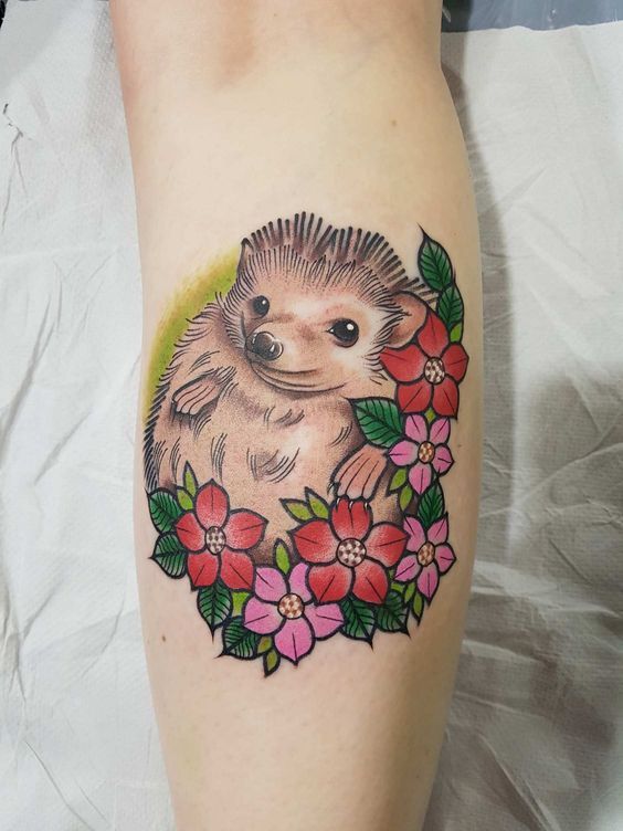 Tattoo of a hedgehog on the forearm for women