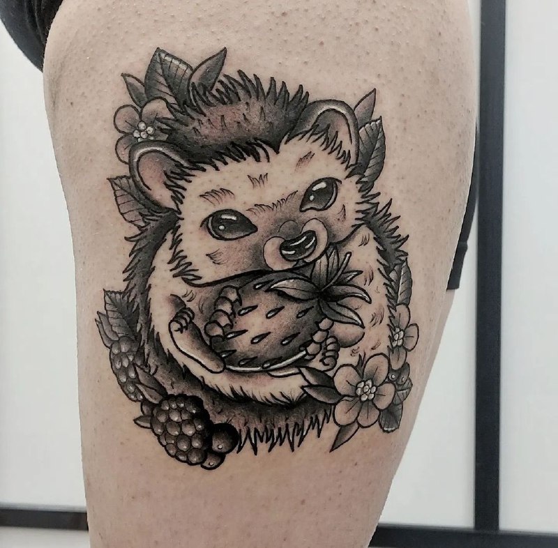 Tattoo of a hedgehog on the hip for women