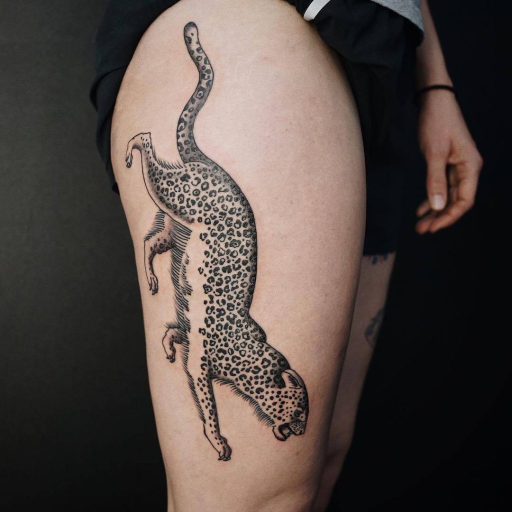 Cheetah tattoo on the hip for women