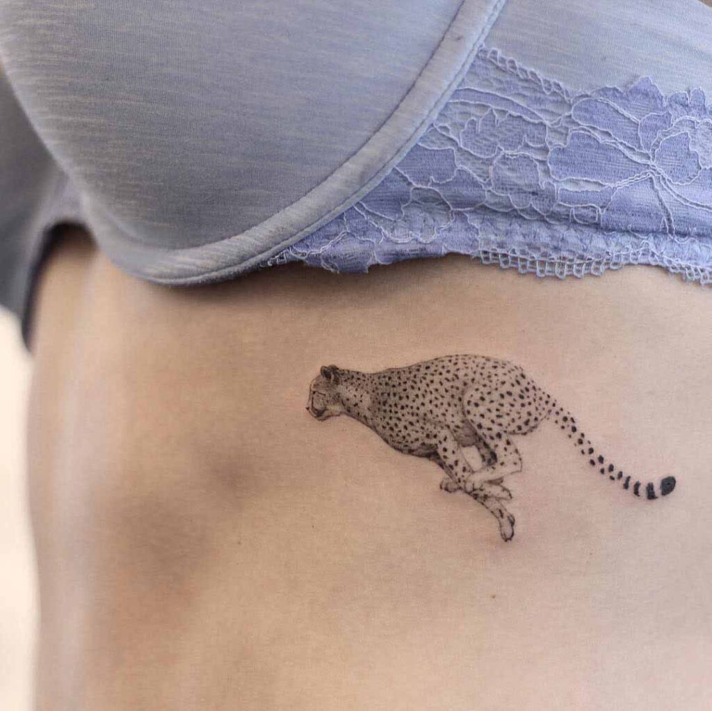 Cheetah tattoo on the stomach for women