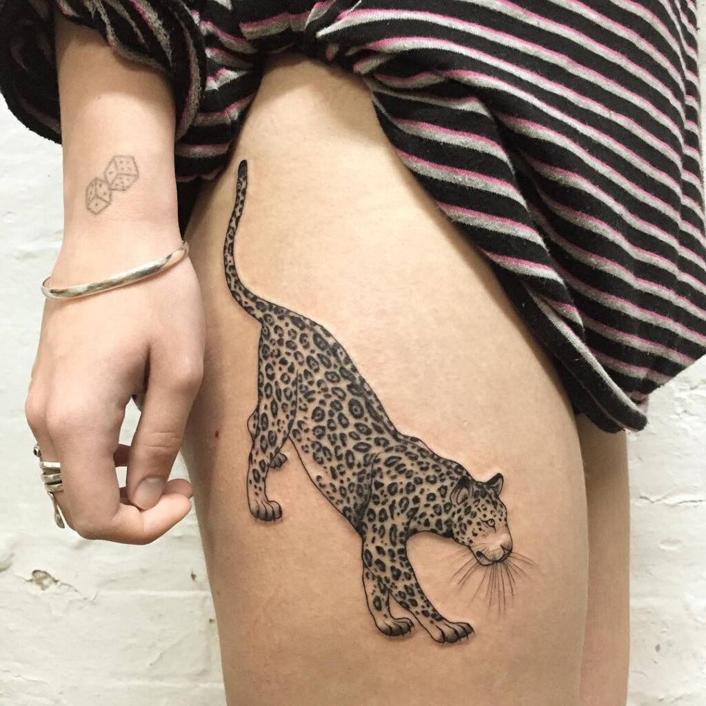 Cheetah tattoo on the hip for women